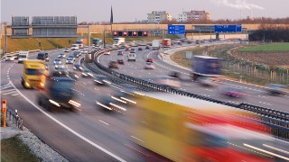 German Autobahn near Munich, blurred headlight, blurred truck in foreground