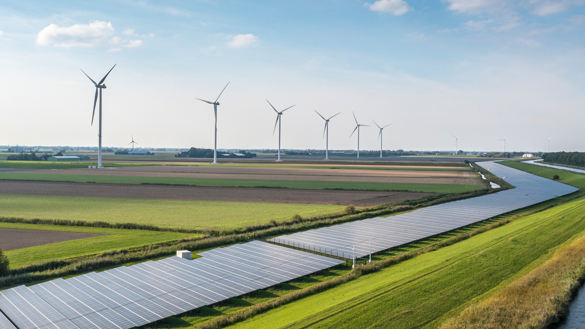 Solar panels and wind turbines generating renewable energy for green and sustainable future.