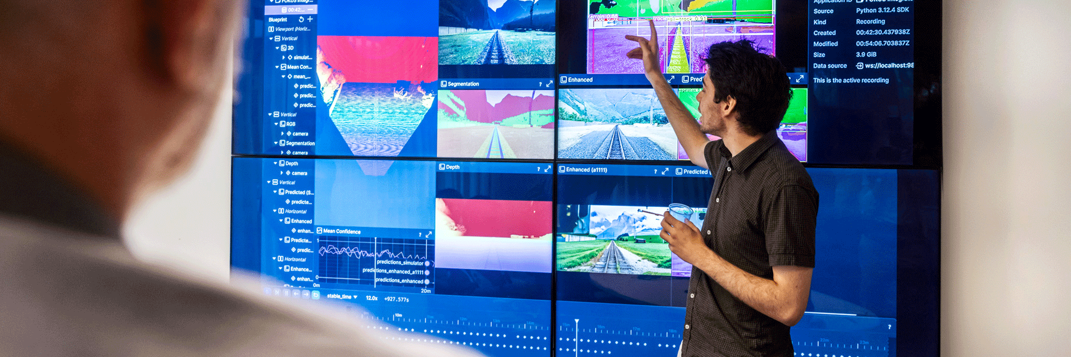 Man in front of a monitor. 