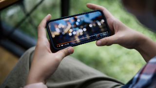While quarantine a women watching live streaming by application on smartphone