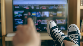 Relaxed Person At Home Watching TV. Video Streaming Concept