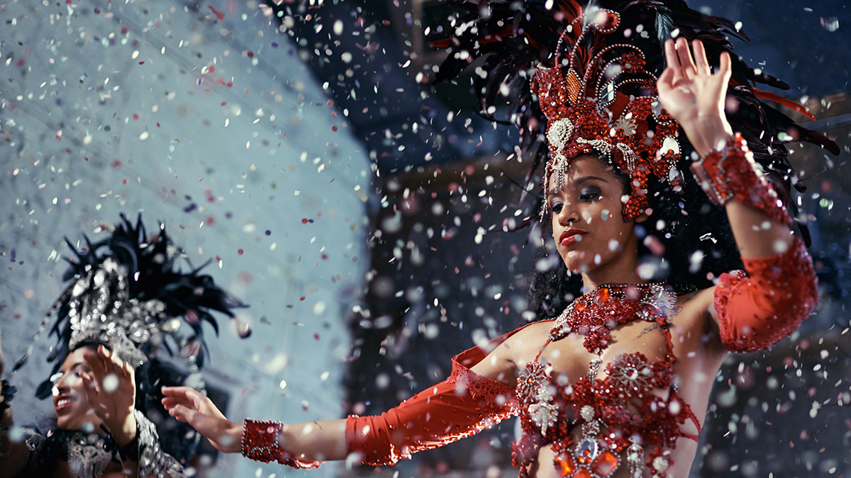Shot of two beautiful samba dancers performing in a carnival