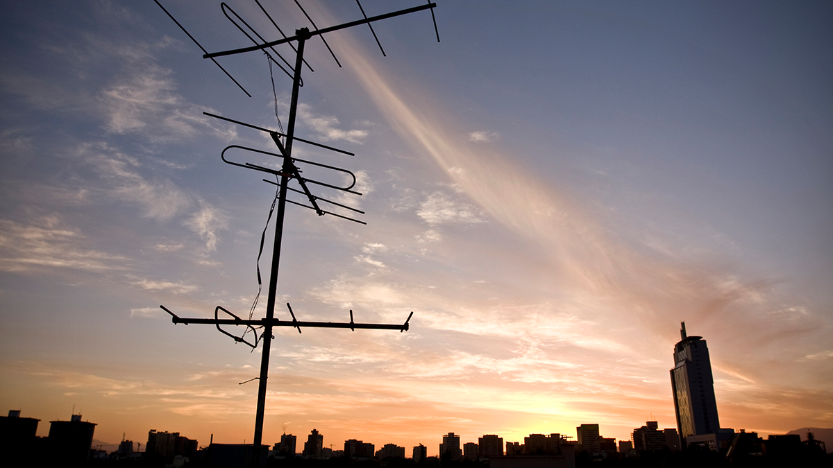 Antenna and skyine at dusk in Santiago. Chile.
