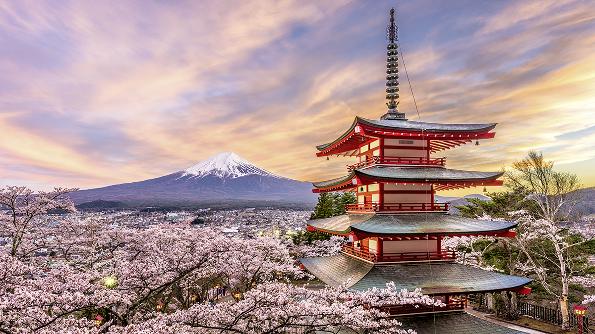 Fujiyoshida, Japan at Chureito Pagoda and Mt. Fuji in the spring with cherry blossoms.