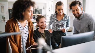 People in front of the computer during a meeting