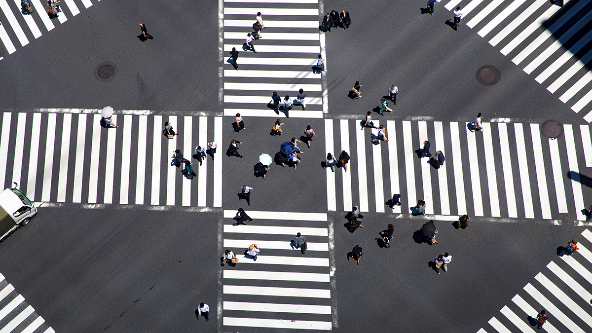 SQC, Technologien: RACOMAT crosswalks with a large group of people walking on them